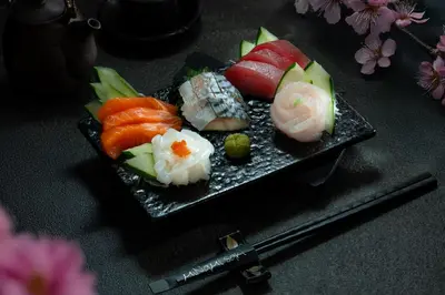 a plate of sushi with vegetables on a table at Astoria Plaza in Manila
