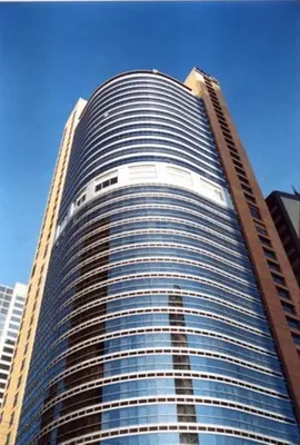 a tall building with a lot of windows at Discovery Suites Manila, Philippines in Manila