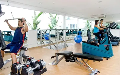 a man exercising on a treadmill in a gym at St Giles Hotel Makati in Manila