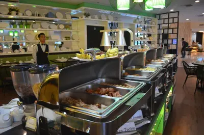 a buffet line with trays of food in a restaurant at El Cielito Inn - Sta. Rosa in Santa Rosa