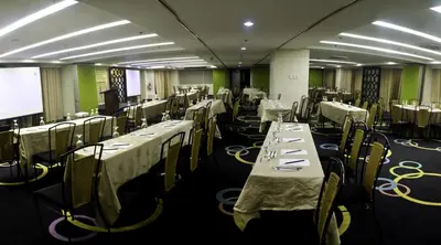 a banquet hall with tables and chairs with white table cloth at El Cielito Inn - Sta. Rosa in Santa Rosa