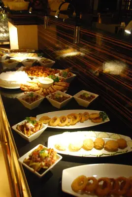 a buffet line with many different types of food at Swiss-Belhotel Blulane in Manila