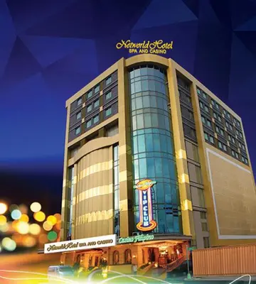 a large building with a sign on top of it at Networld Hotel Spa and Casino in Manila