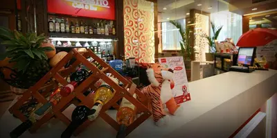 a stuffed tiger sitting on a counter in a store at Networld Hotel Spa and Casino in Manila