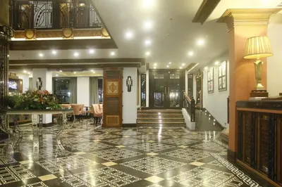 a lobby with a floor of black and white tiles at Herald Suites Polaris in Manila