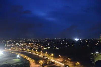 a view of a city at night with lights at Parque España Residence Hotel in Manila