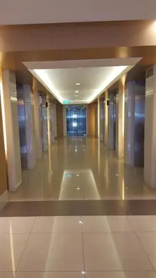 an empty hallway of a building with a lobby at Breeze Residences by CS Luxe in Manila