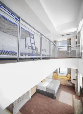 a room with a bed and a balcony at TRYP by Wyndham Mall of Asia Manila in Manila