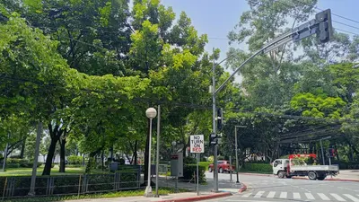an intersection with a traffic light and a truck on a street at KL Executive Greenbelt (KLX) in Manila