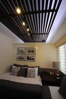 a bedroom with a bed and a black ceiling at 5E Tower 2 Viceroy in Manila