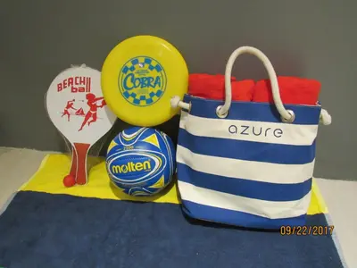 a blue and white bag and a yellow frisbee at Azure Urban Beach Resort Manila by Radlett in Manila