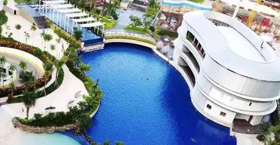 an aerial view of a resort with a large building at Azure Urban Beach Resort Manila by Radlett in Manila