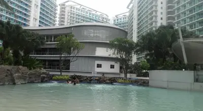 a pool of water in front of a building at Joanne Sweet Home in Manila
