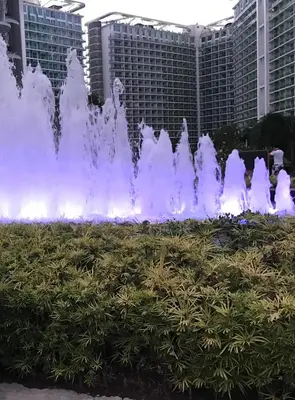 a water fountain in front of some buildings at Joanne Sweet Home in Manila