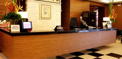 a bar in a restaurant with a counter top at Manila Grand Opera Hotel in Manila