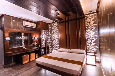 a bedroom with a bed and a sink in it at Hotel Ava Malate in Manila