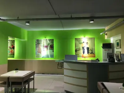 a green room with a counter and a table at Centropolis in Manila