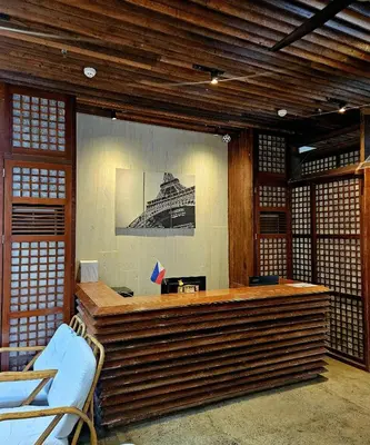an office with a large desk in a building at Monchere Dormitory in Manila