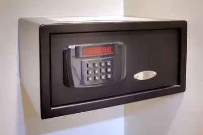 a microwave oven with a clock on it at Rothman Hotel in Manila