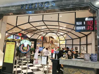a store front with people standing in a mall at SNAPz Staycation @ Jazz Residences in Manila
