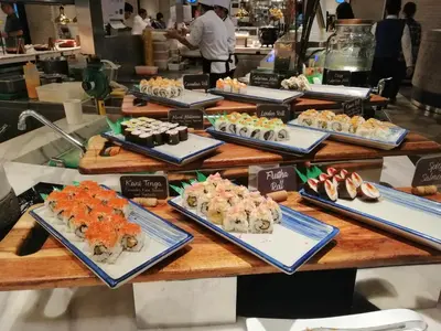 a table filled with different types of food on plates at SNAPz Staycation @ Jazz Residences in Manila