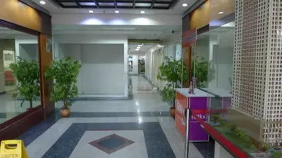 a hallway with potted plants in a building at Leons Den is a long term accomodation of atleast 1 month stay in Manila