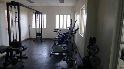 a room with a gym with several exercise bikes at Leons Den is a long term accomodation of atleast 1 month stay in Manila