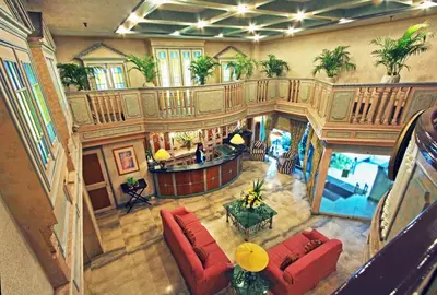 an overhead view of a living room with red furniture at Manila Manor Hotel in Manila
