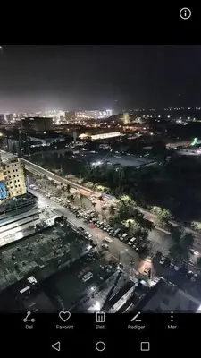 an aerial view of a city at night at SMDC Breeze Residences by Dominga in Manila