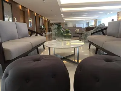 a lobby with couches and a table in a store at SMDC Breeze Residences by Dominga in Manila