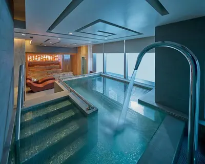 a swimming pool in a hotel room with a swimming pooliterator at Grand Hyatt Manila in Manila