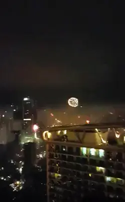 a view of a city at night with a fireworks at Modern Luxury Lower Penthouse Unit in Manila