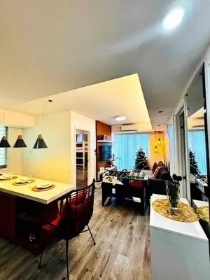 a living room with a couch and a table at Holiday Escape Philippines in Manila