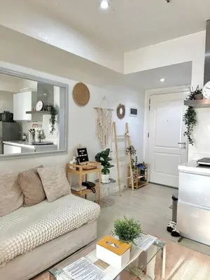 a living room with a couch and a table at AZURE URBAN RESIDENCES- Beach View in Manila