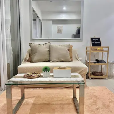 a coffee table in a living room with a couch at AZURE URBAN RESIDENCES- Beach View in Manila