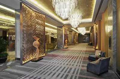 a hallway of a hotel with a chandelier at Hilton Manila Newport World Resorts in Manila