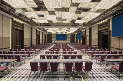 an empty hall with tables and chairs in it at Hilton Manila Newport World Resorts in Manila