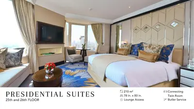 a hotel room with a bed and a television at Diamond Hotel Philippines in Manila