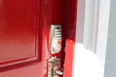 a remote control sticking out of a red door at # 15 Laguna Bel-Air Home in Sta Rosa by Red Door House Rental in Santa Rosa