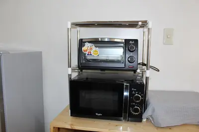 a microwave oven sitting on top of a microwavesounter at # 15 Laguna Bel-Air Home in Sta Rosa by Red Door House Rental in Santa Rosa