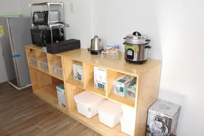 a wooden shelf with food and a coffee maker on it at # 15 Laguna Bel-Air Home in Sta Rosa by Red Door House Rental in Santa Rosa