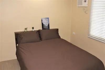a bed with a brown bedspread in a bedroom at # 15 Laguna Bel-Air Home in Sta Rosa by Red Door House Rental in Santa Rosa