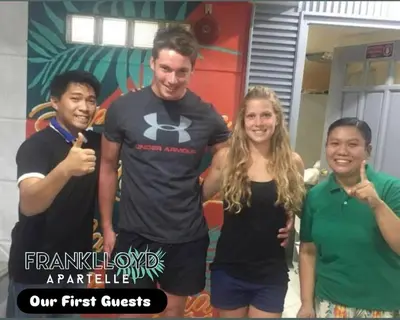 a group of three people posing for a picture at Frank Lloyd Apartelle in Manila
