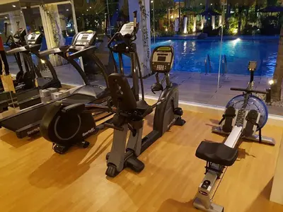 a gym with several treadmills and a bike at Mount Sea Resort in Rosario