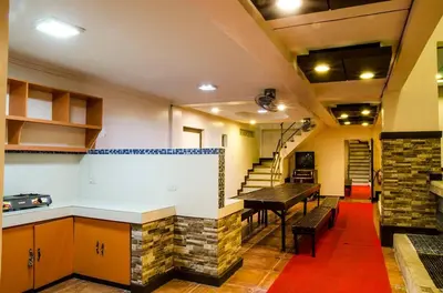 a kitchen and dining room with a table and a brick wall at Dreamwave Resort Pansol Laguna in Calamba