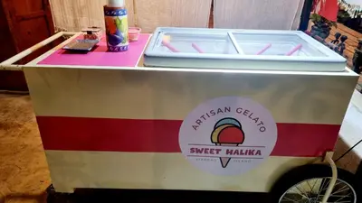 a ice cream cart with a drink on top of it at Marius B&B & Hostel in Silang