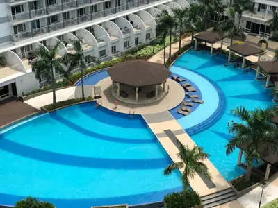 an overhead view of a large pool in a building at RLR Condo at Shell Residences in Manila