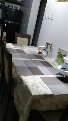 a black and white checkerboard table in a kitchen at Burgundy McKinley Place in Manila
