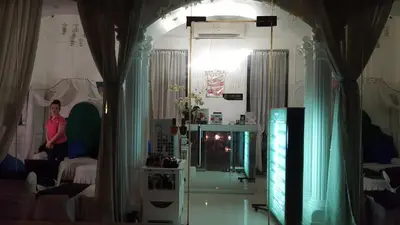 a woman is standing in a room with a living room at Morgan Suites in Manila