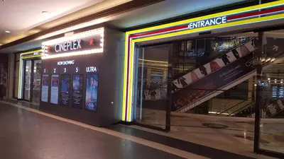 a store front with a staircase in a shopping mall at Morgan Suites in Manila